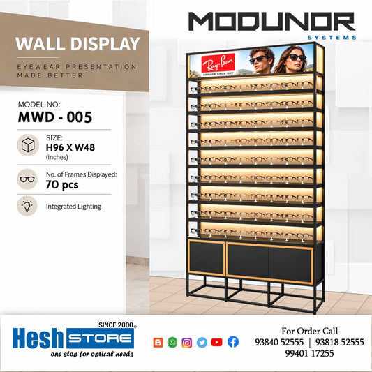 Black and gold illuminated optical wall display cabinet with multiple eyewear shelves, branded header and bottom storage panels, model MWD-005.